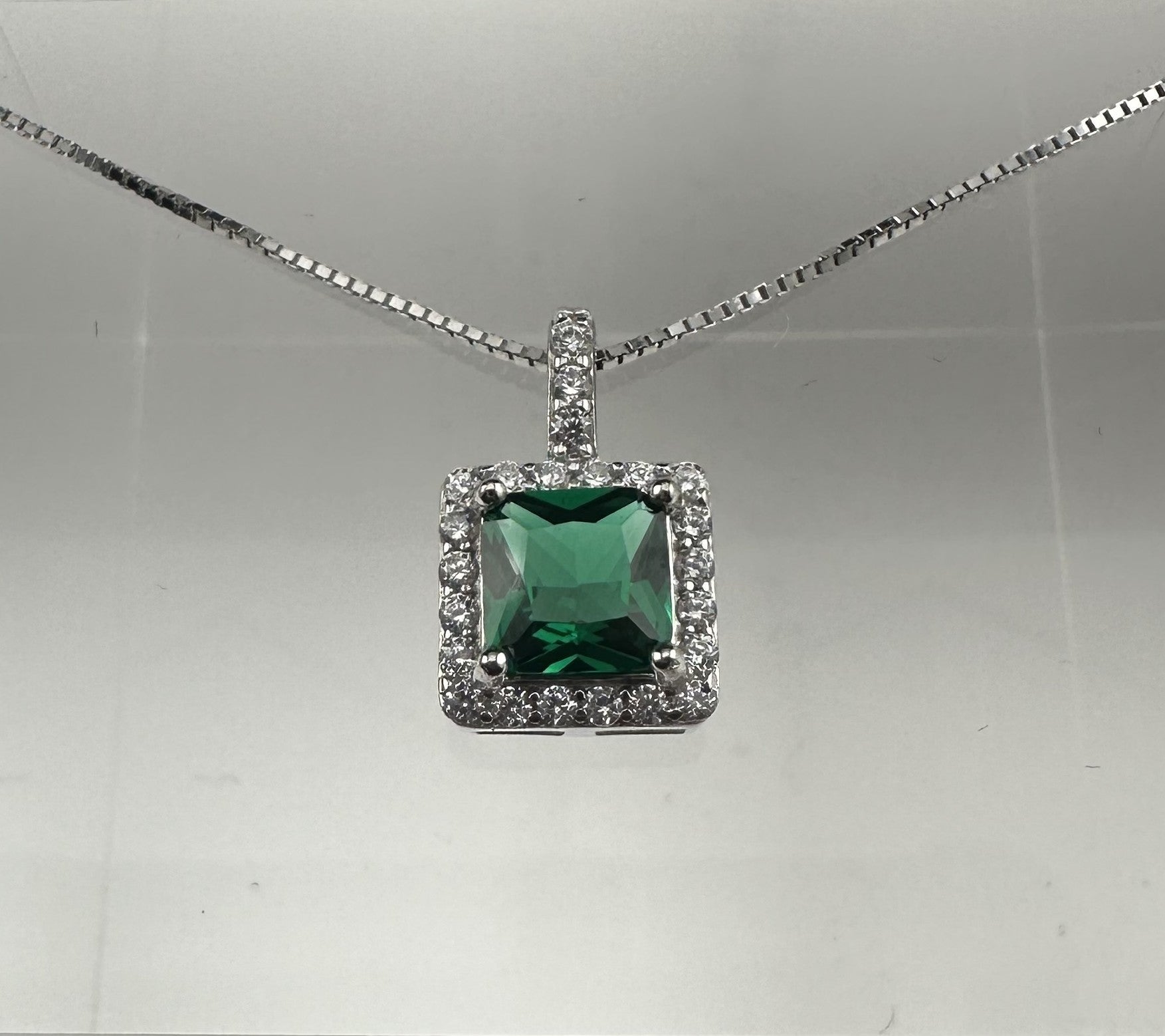 The Smeraldo Halo Pendant: An Emerald Vision in .925 Silver