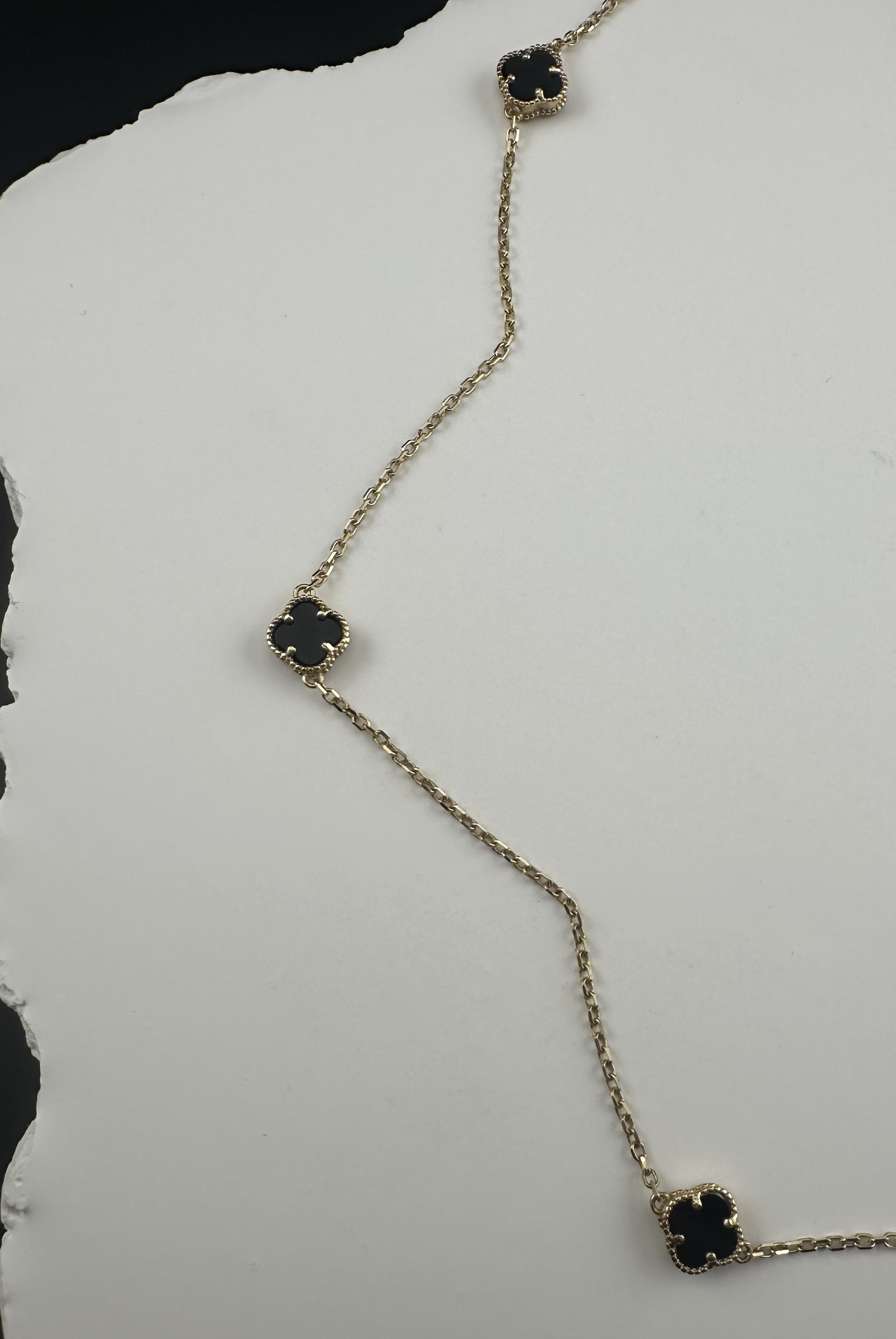 The Notte d'Oro Clover: A Legacy in 18k Gold and Onyx