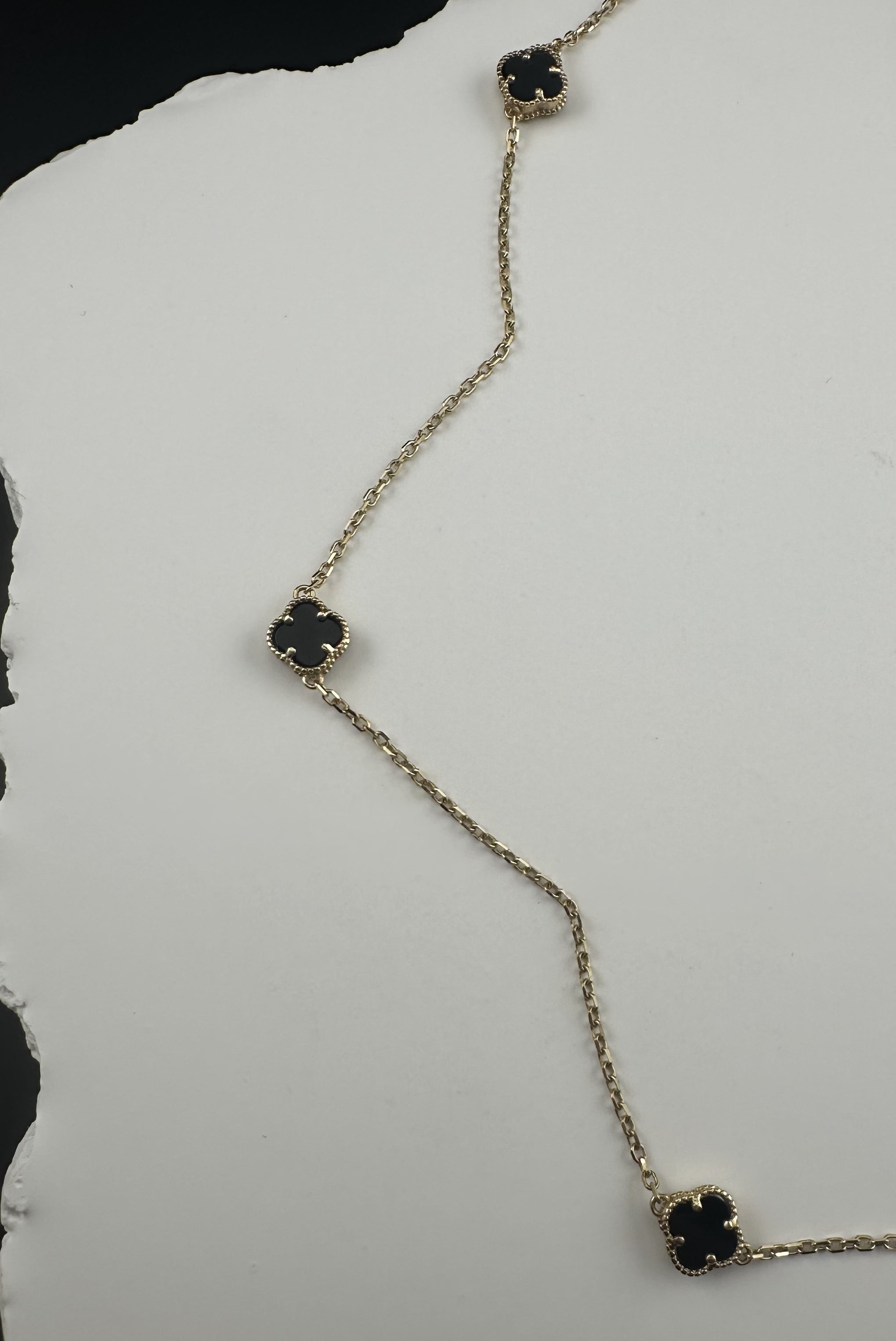 The Notte d'Oro Clover: A Legacy in 18k Gold and Onyx